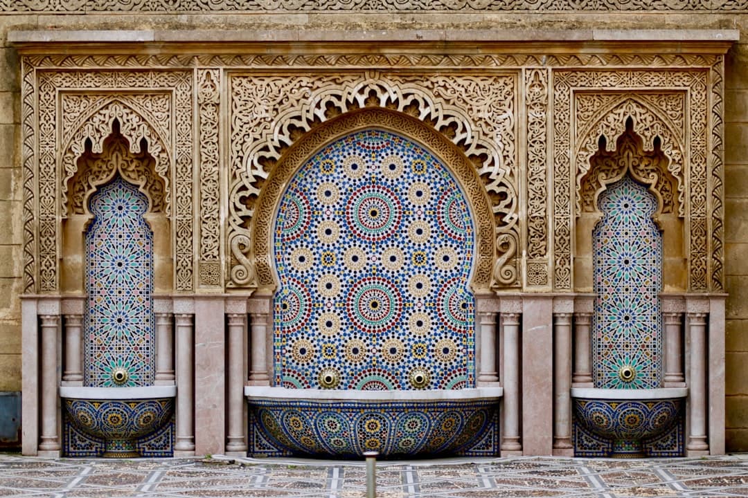 Moroccan hammam and spa — a candlelit riad spa with Moorish arches, lanterns and a zellige-tiled pool