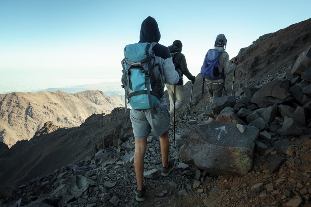 Mount Toubkal trek — trekkers on the summit ridge of North Africa's highest peak (4,167m) in the High Atlas