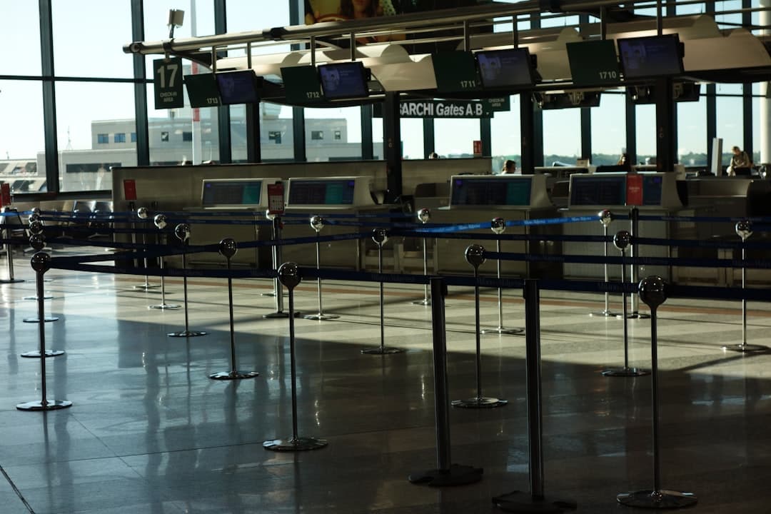Flying with a surfboard to Morocco - a padded board bag at an airport check-in counter ready for oversize baggage drop