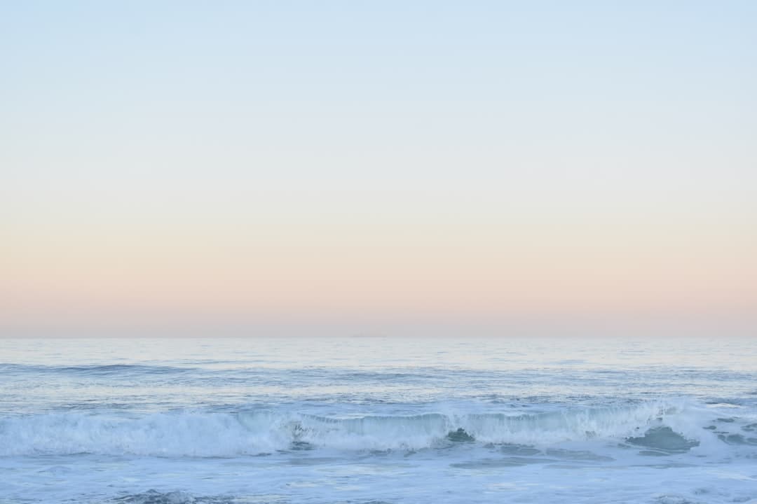 Best time to surf Morocco - clean winter point-break wave peeling at dawn on the Atlantic coast with offshore spray and an empty lineup